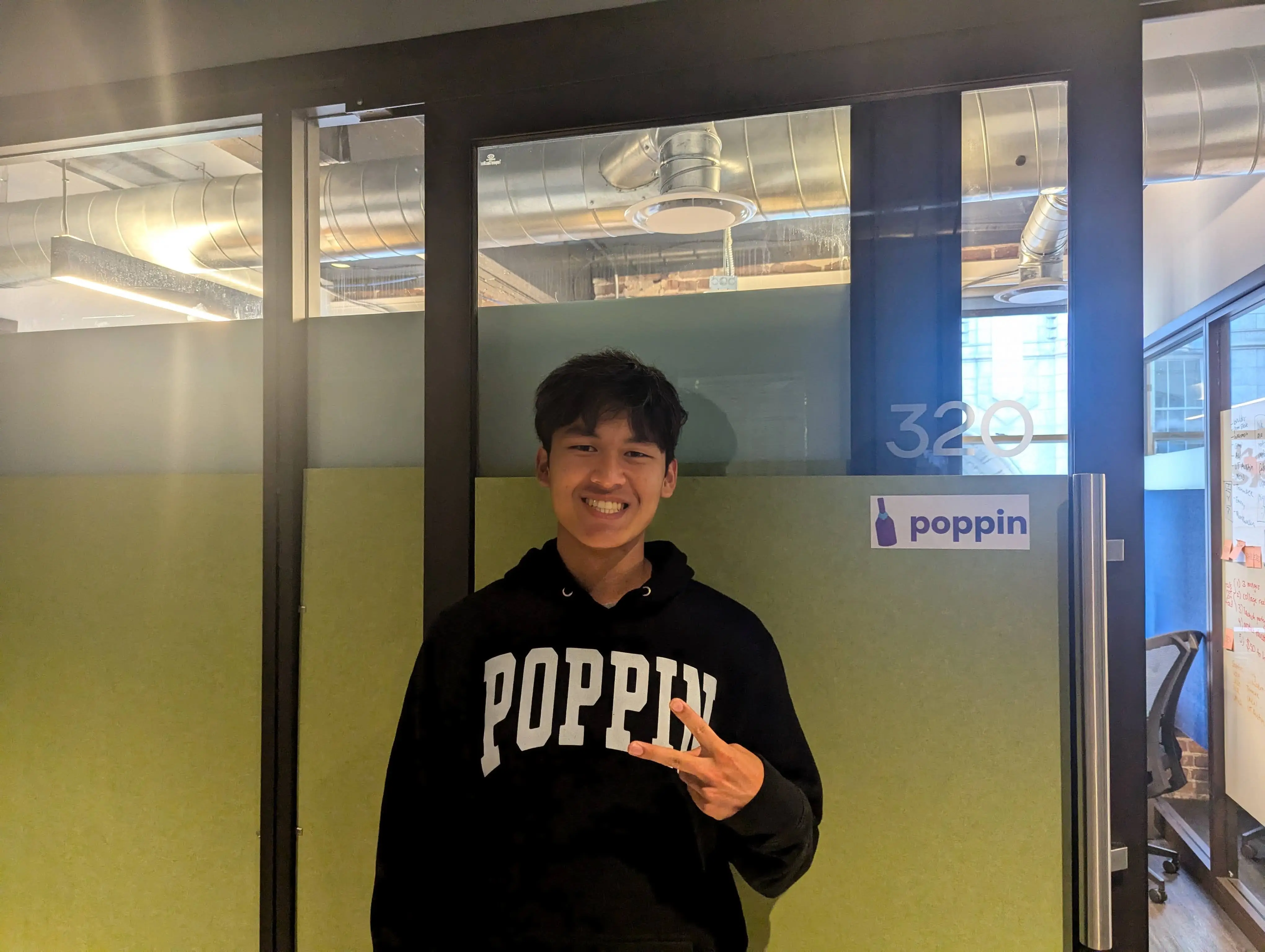 Sonav posing outside the Poppin office